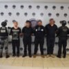 Logos oficiales superpuestos: Fiscalía General de Michoacán, Guardia Civil, Secretaría de la Defensa Nacional y Guardia Nacional, sobre fondo azul oscuro