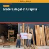 Vista exterior de centro de almacenamiento de madera clausurado en Urapilla, con sellos oficiales y madera visible — madera